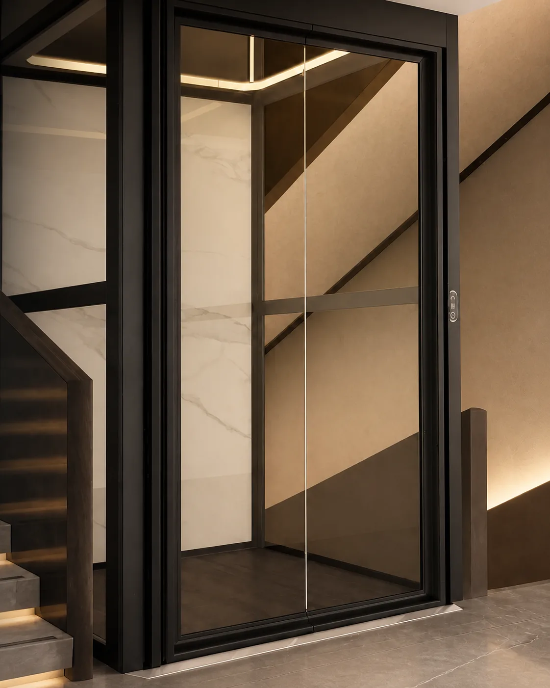 Black framed glass home elevator installed beside a staircase