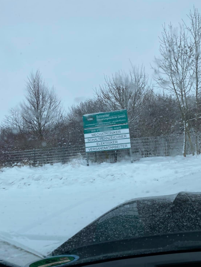 Schneider Steuerungstechnik facility sign in snowy Maitenbeth, Germany
